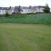 Photo 7: View of terrace from green 