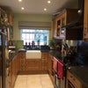 Photo 4: Modern kitchen including lots of storage, dish washer, microwave, large American style fridge freeze