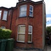 Photo 6: Front of house with parking