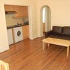 Photo 2: Reception Room + Kitchen