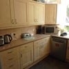 Photo 7: Kitchen with dishwasher, washing machine, cooker, microwave, fridge/freezer, cutlery/crockery/pots.