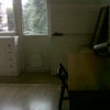 Photo 2: entrance to room =. Desk, dressing table and door to balcony.