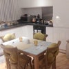 Photo 3: Marble top dining table, fridge/freezer, kettle, microwave, oven/ electric hob
