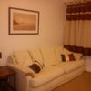 Photo 2: Lounge before the room was renovated but sofa remains and very comfortable.