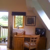 Photo 3: View to front door with desk &  TV DVD