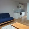 Photo 5: futon and book case view