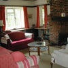 Photo 2: Lounge with open-fire