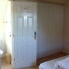 Photo 3: Door to ensuite showing fitted wardrobes