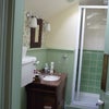Photo 2: The pretty shower room is just off the bedroom