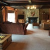 Photo 5: Front room, log burner, doors to gardens. 