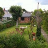Photo 4: Garden with furniture and shed for storage