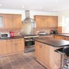 Photo 4: Spacious fully equipped kitchen and dining area