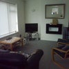 Photo 6: Lounge showing TV, Sky Coffee table etc
