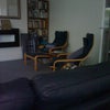 Photo 7: Other side of Lounge showing armchairs, stool and bookcase