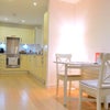 Photo 2: dining table and kitchen