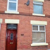 Photo 5: Front of house with parking 
