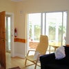 Photo 7: Shared lounge looking out to conservatory