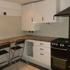 Photo 6: Kitchen with large breakfast bar/ communal area