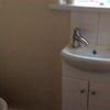 Photo 6: Adjacent toilet and wash room.