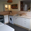 Photo 2: Kitchen has tumble dryer and fridge, A+ rated