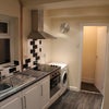 Photo 4: luxury kitchen with breakfast bar and four seats.