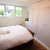 Photo 2: Bedroom example - bright, light, neutral decor.