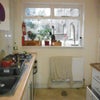 Photo 3: Kitchen- sink, hob, oven and window looking onto the garden