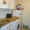 Photo 4: kitchen- washing machine and fridge. the room comes with a kettle and toaster!!!