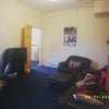 Photo 3: current living (will get new paint job, new tv, nuw furniture and new carpet)