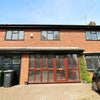 Photo 3: Front. Entrance porch with storage.