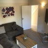 Photo 2: Lounge with  65" TV, large corner sofa, SKY Q and access to the back garden