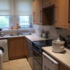 Photo 3: Kitchen - Showing the washing machine, freezer, cooker and fridge.