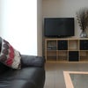 Photo 2: Sitting room with flat screen TV