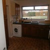 Photo 3: A bad photo of the kitchen