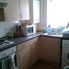 Photo 2: kitchen with microwave, washing machine, etc