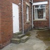 Photo 7: Rear lane entrance into secure yard