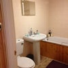Photo 4: The en suite bathroom includes shower.