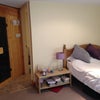Photo 5: Bed in different position, sauna door and bathroom door.