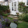 Photo 5: Sunny garden. Complete with flowers and somewhat unwelcome squirrel.