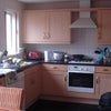 Photo 4: Kitchen with Dining Table to Other End
