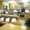 Photo 7: Oak effect kitchen with integrated appliances