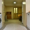 Photo 2: Kitchen includes washing machine