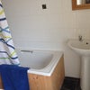 Photo 5: Bath and power shower in main bathroom
