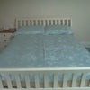 Photo 4: Bedroom 1- currently has bed, bedside cabinet and desk
