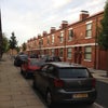 Photo 9: Street outside with parking