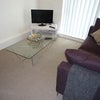 Photo 3: Lounge leading on to balcony
