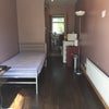 Photo 2: View of the room with furniture..