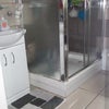 Photo 4: shared luxury bathroom with toilet sink and shower