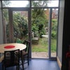 Photo 7: Kitchen opens onto leafy Garden