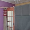 Photo 4: bedroom door with pull across curtain